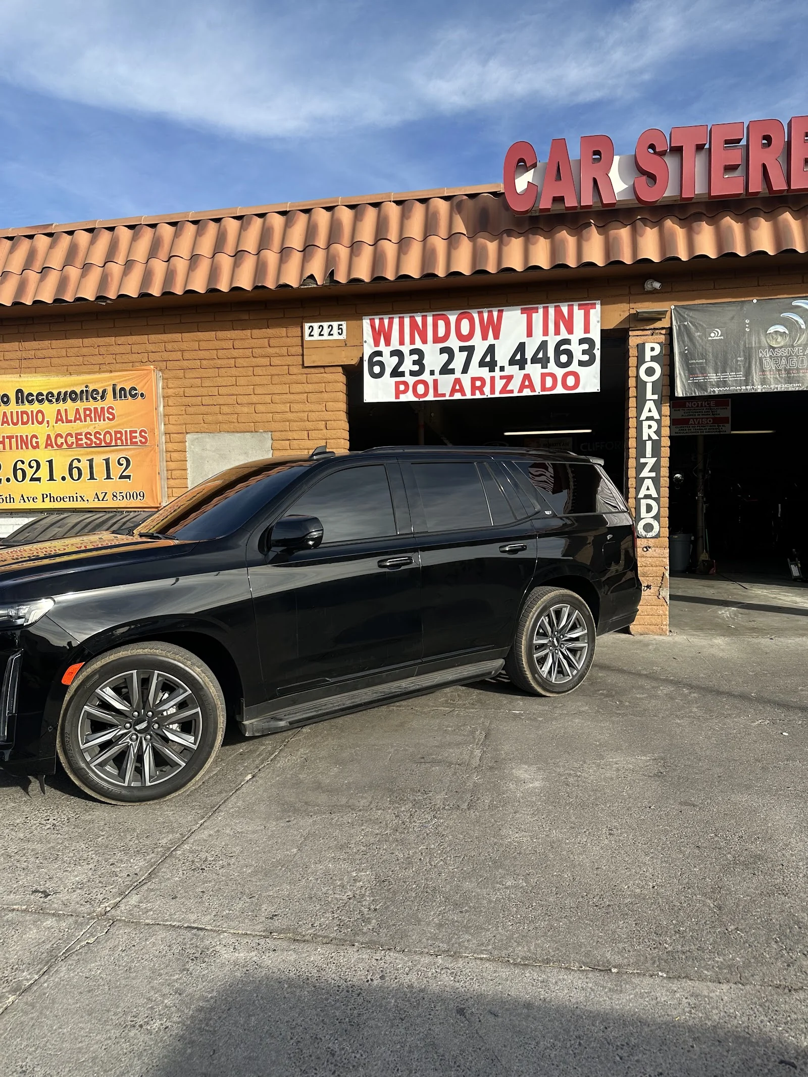 Tinted Cadillac Escalade outside Desert Window Tint & Wraps